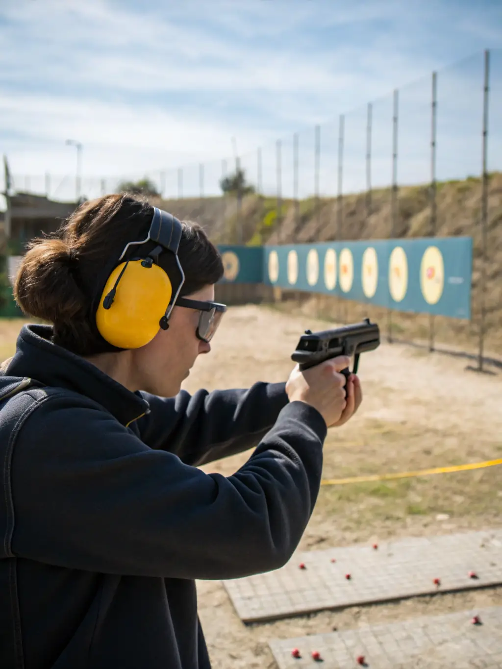 A group of participants receiving instructions on firearm safety and handling during a training program at BALL TRAP CLUB DE LA MALEPERE.